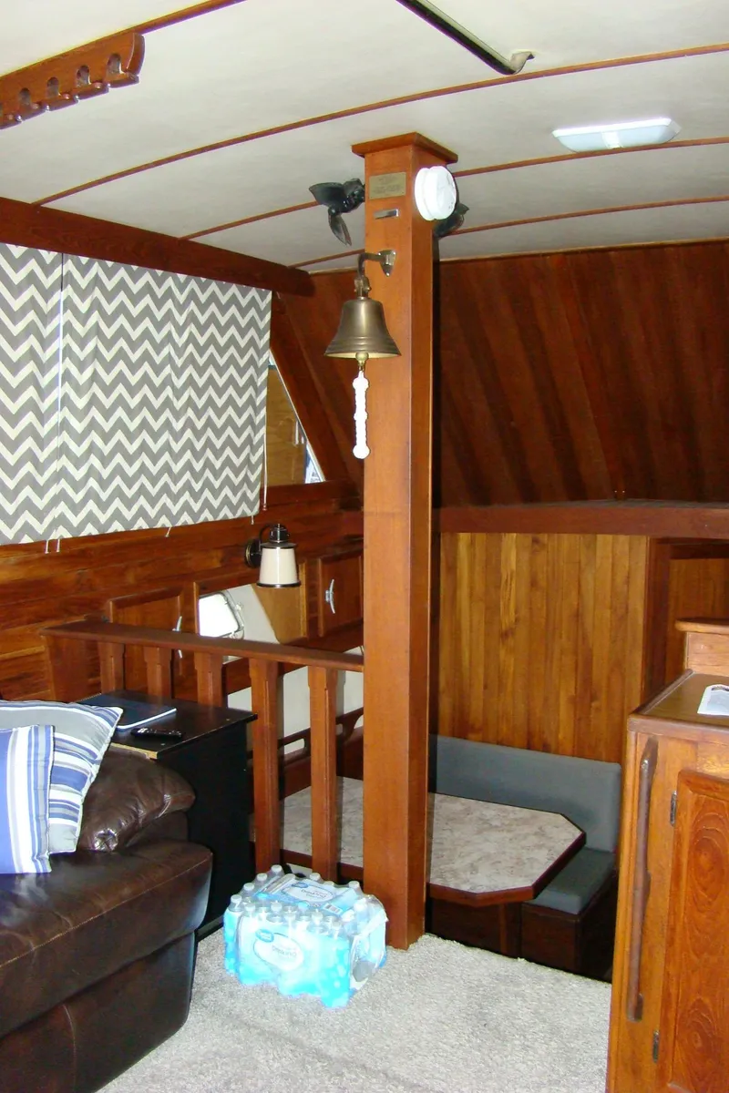 Slide: The Image of Interior of 1985 Jersey Dawn 40 boat with wood paneling and seating area. - 41