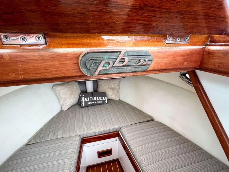 Slide: The Image of Interior cabin of 2004 Custom Pemaquid Beach 22 boat with cozy bedding. - 10