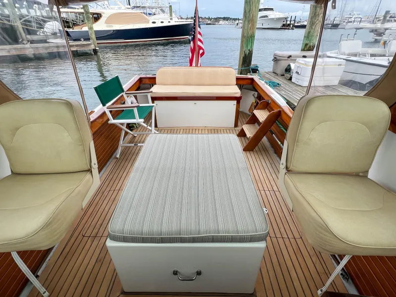 Slide: The Image of Interior of 2004 Custom Pemaquid Beach 22 boat with seating and table. - 17
