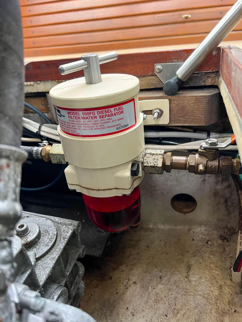 Slide: The Image of Diesel fuel filter water separator in a 2004 Custom Pemaquid Beach 22 boat. - 26