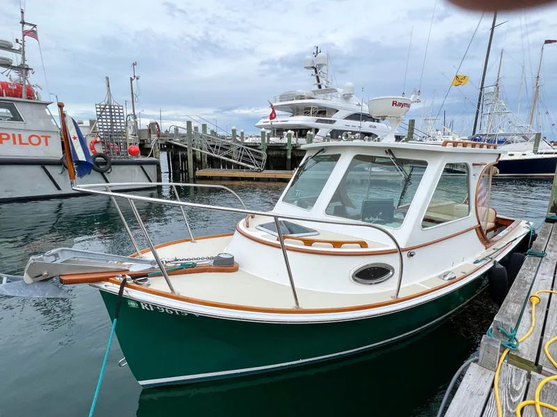Slide: The Image of 2004 Custom Pemaquid Beach 22 boat docked at a marina. - 31