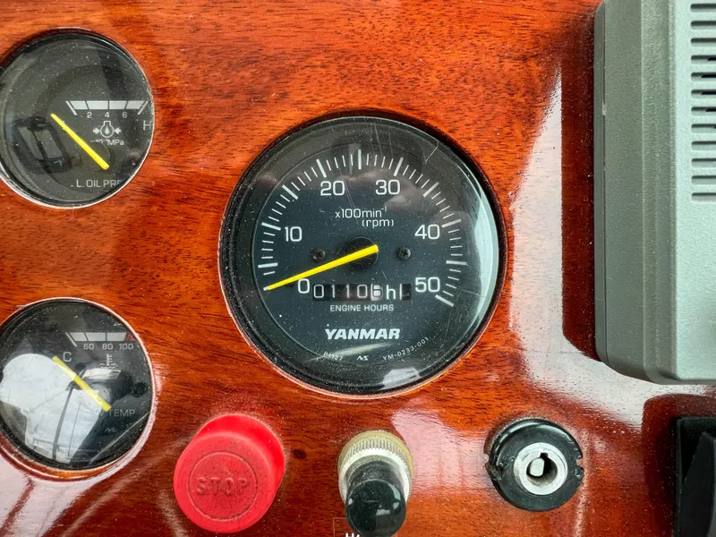 Slide: The Image of Close-up of 2004 Custom Pemaquid Beach 22 boat dashboard with Yanmar engine hour meter. - 36