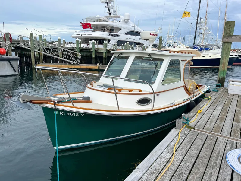 Slide: The Image of Custom 2004 Pemaquid Beach 22 boat docked at a marina. - 42