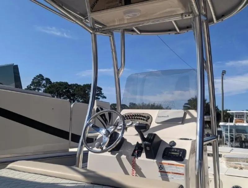 Slide: The Image of 2022 Carolina Skiff 23 LS boat console with steering wheel and controls. - 5