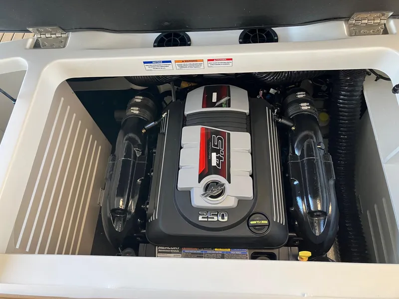 Slide: The Image of 2024 Sea Ray SPX 210 boat engine compartment with 250 HP engine. - 14