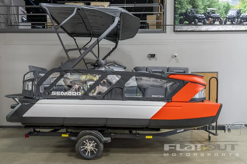 Slide: The Image of 2024 Sea-Doo SWITCH Cruise-18 230HP pontoon boat on trailer in showroom. - 1