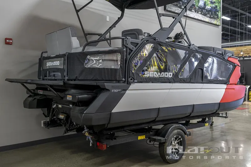 Slide: The Image of 2024 Sea-Doo SWITCH Cruise-18 230HP pontoon boat on display indoors. - 4