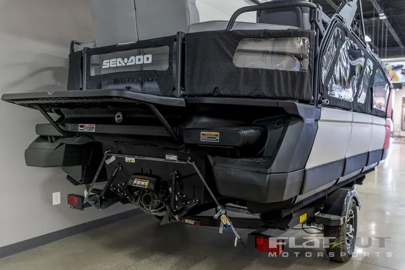 Slide: The Image of 2024 Sea-Doo SWITCH Cruise-18 230HP on trailer, rear view in showroom. - 5