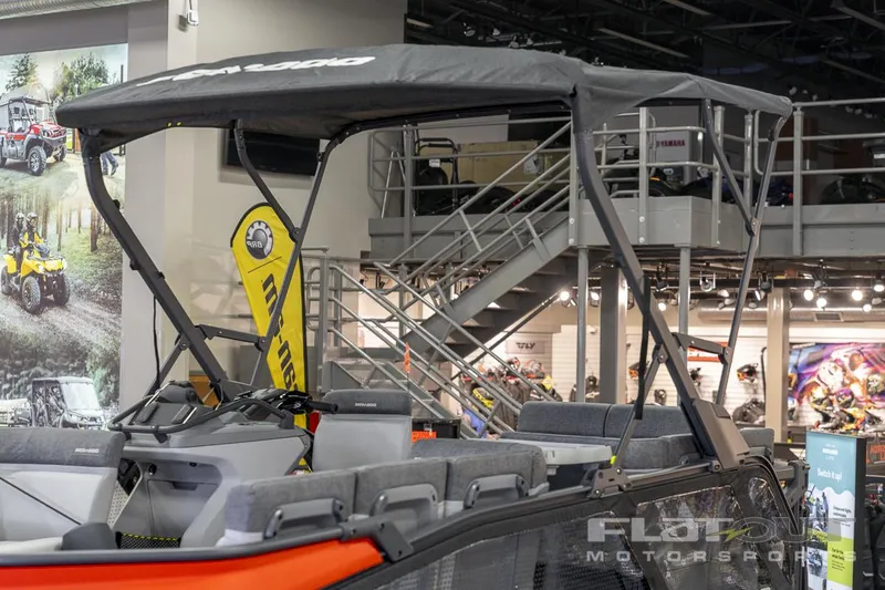 Slide: The Image of 2024 Sea-Doo SWITCH Cruise-18 230HP pontoon boat on display indoors. - 6