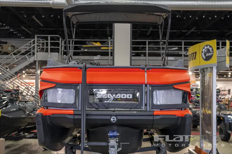 Slide: The Image of 2024 Sea-Doo SWITCH Cruise-18 230HP pontoon boat displayed indoors. - 8