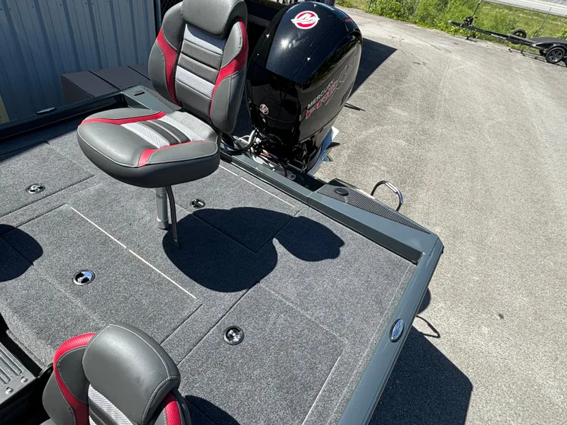 Slide: The Image of 2024 Ranger RT198P fishing boat with Mercury outboard motor and cushioned seats. - 11