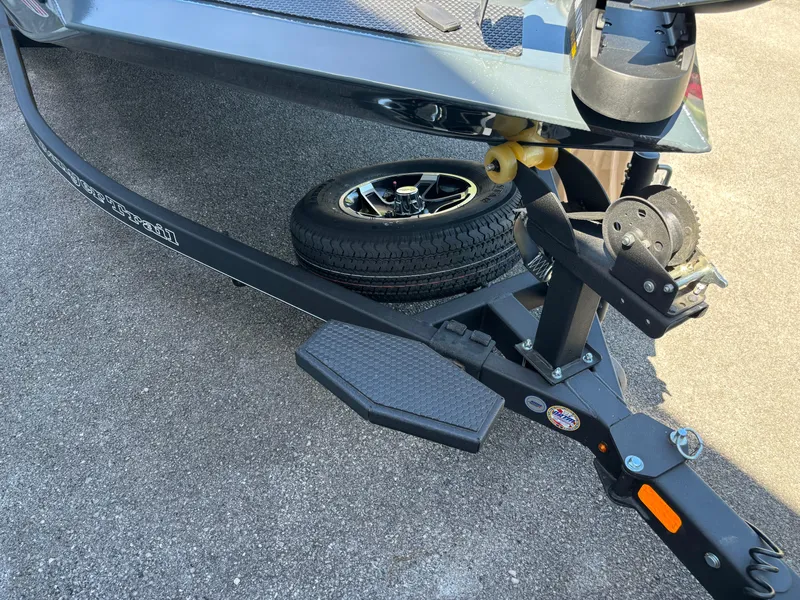 Slide: The Image of 2024 Ranger RT198P boat trailer with spare tire and winch. - 2
