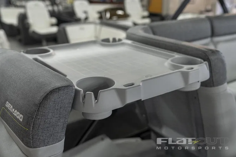 Slide: The Image of 2024 Sea-Doo SWITCH CRUISE 18 230HP interior with cup holders and seating. - 15