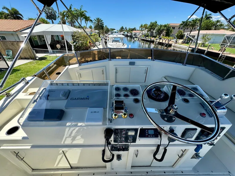 Slide: The Image of 1978 Hatteras 37 Convertible boat helm with Garmin navigation system. - 2
