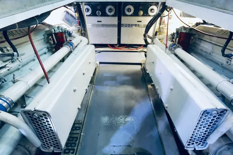 Slide: The Image of Engine room of a 1978 Hatteras 37 Convertible yacht with dual engines. - 9
