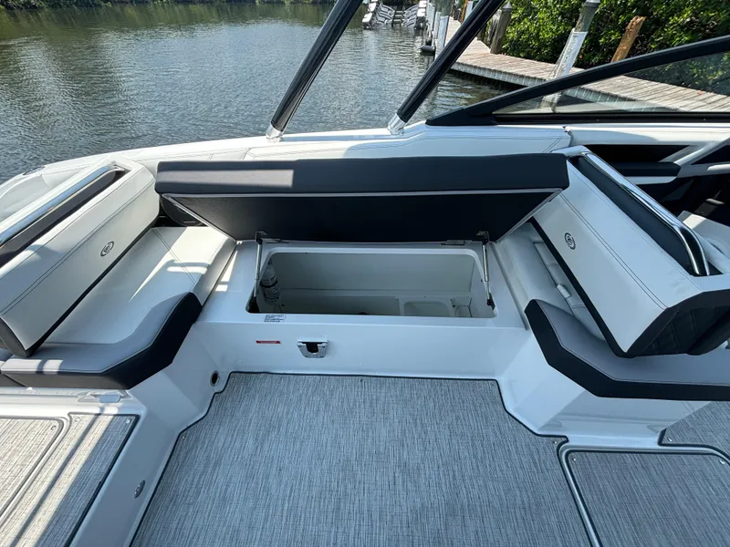 Slide: The Image of 2024 Cobalt R8 Outboard boat interior with open storage compartment. - 10