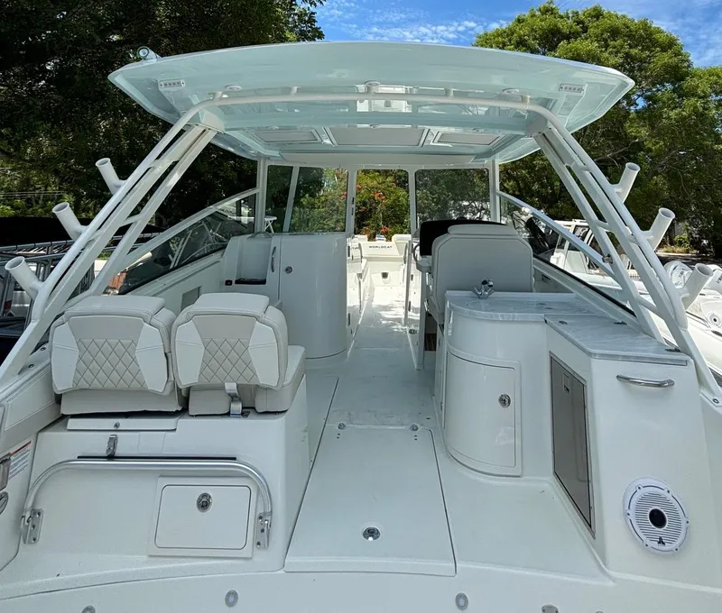 Slide: The Image of 2024 World Cat 325 DC boat interior with seating and helm station. - 23