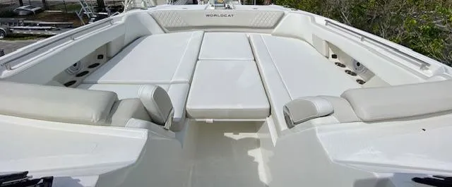 Slide: The Image of 2024 World Cat 325 DC boat with spacious seating and white upholstery. - 28
