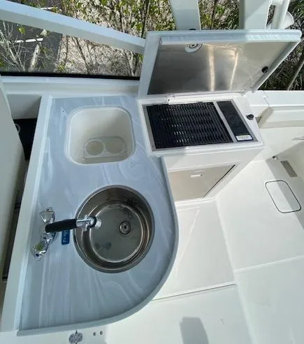 Slide: The Image of 2024 World Cat 325 DC boat galley with sink and grill. - 7