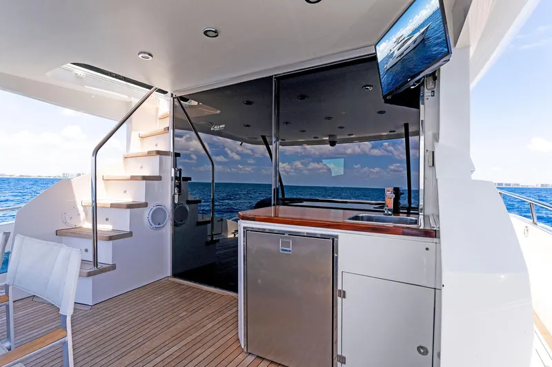 Slide: The Image of Luxury yacht Lazzara 64, 2014 model, featuring outdoor seating and ocean view. - 18
