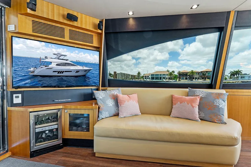 Slide: The Image of Luxurious interior of 2014 Lazzara 64 yacht with leather sofa and large windows. - 23