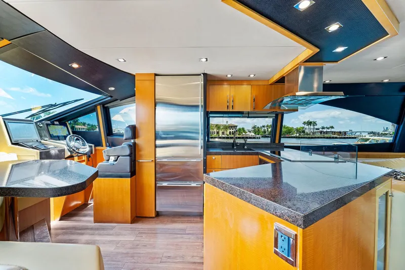 Slide: The Image of Luxurious interior of 2014 Lazzara 64 yacht with modern kitchen and helm station. - 27