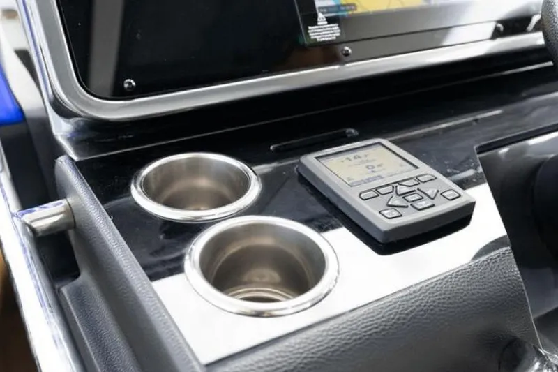 Slide: The Image of Control panel of 2023 Azimut Verve 42 with cup holders and electronic display. - 12