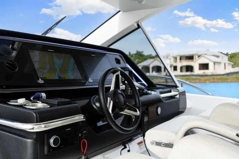 Slide: The Image of 2023 Azimut Verve 42 yacht cockpit with modern navigation system and luxurious seating. - 13