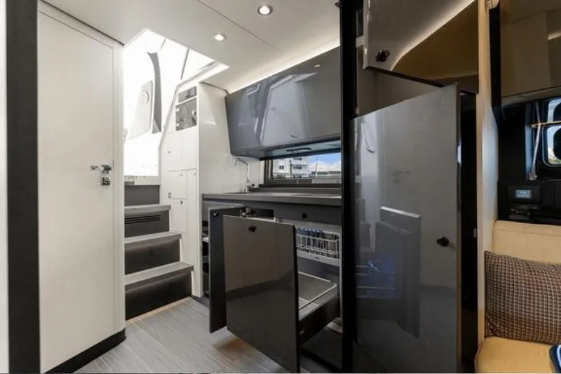 Slide: The Image of Interior of 2023 Azimut Verve 42 yacht, featuring modern kitchen and sleek design elements. - 15