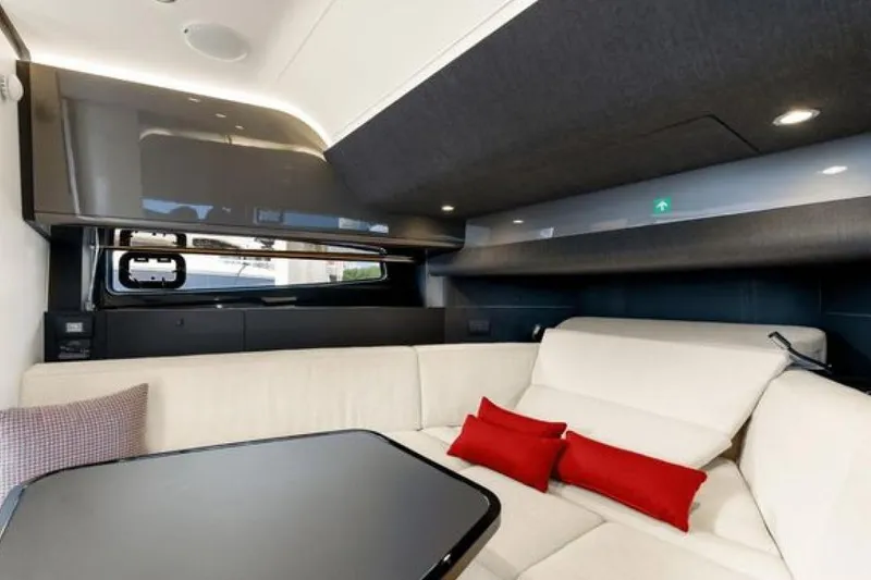 Slide: The Image of Luxurious interior of 2023 Azimut Verve 42 yacht with modern seating and red cushions. - 19