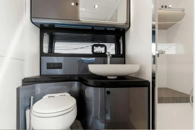 Slide: The Image of Luxurious bathroom interior of 2023 Azimut Verve 42 yacht, featuring modern sink and toilet. - 21