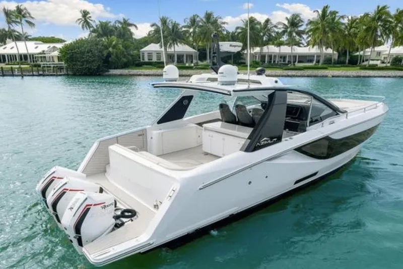 Slide: The Image of 2023 Azimut Verve 42 luxury yacht on tranquil water, surrounded by palm trees. - 4