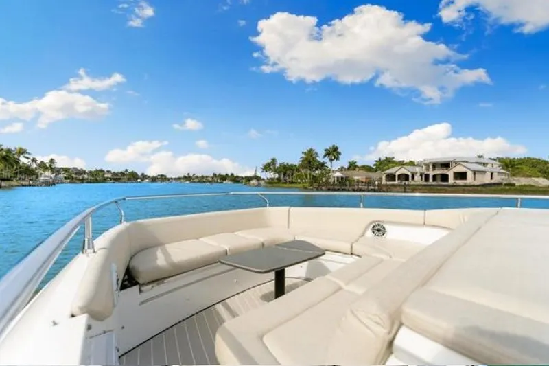 Slide: The Image of 2023 Azimut Verve 42 yacht with luxurious seating, cruising on a sunny day. - 7