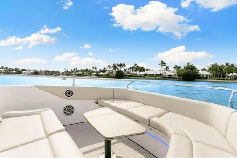 Slide: The Image of 2023 Azimut Verve 42 yacht with luxurious seating, cruising on a sunny day. - 9