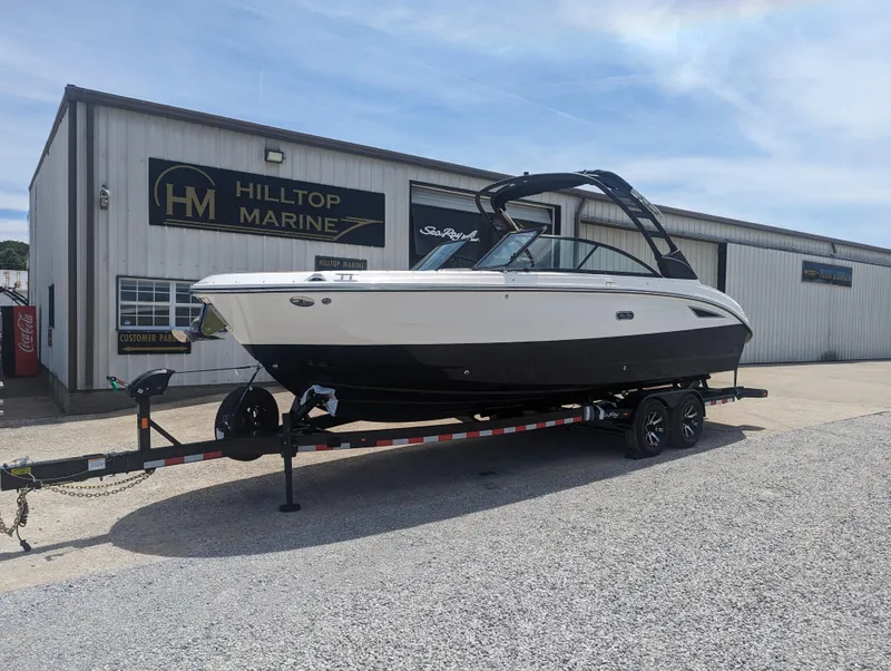Slide: The Image of 2024 Sea Ray SDX 270 boat on trailer at Hilltop Marine dealership. - 2