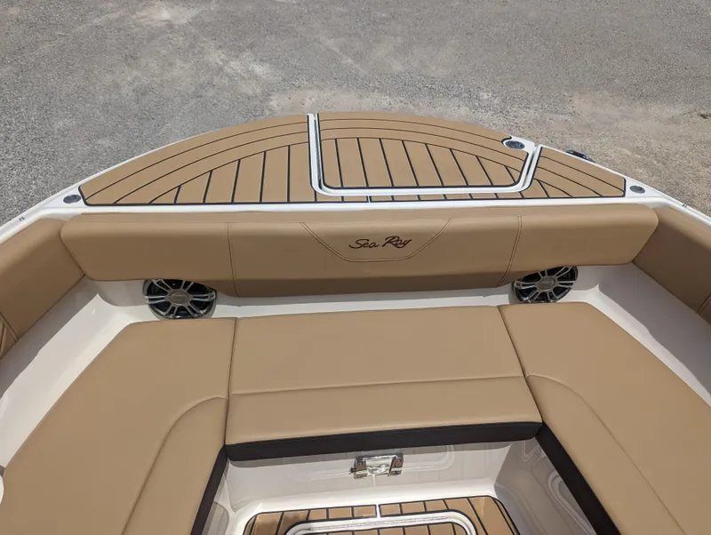 Slide: The Image of 2024 Sea Ray SDX 270 boat interior with tan seating and teak flooring. - 23