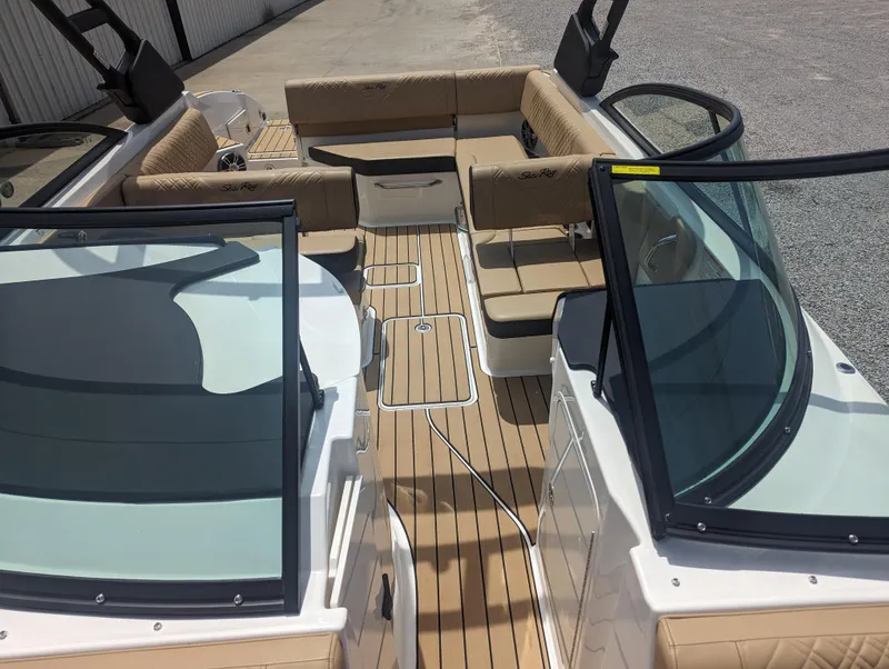 Slide: The Image of 2024 Sea Ray SDX 270 boat interior with tan seating and open deck layout. - 25