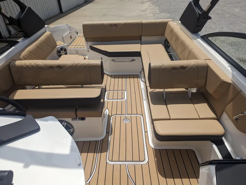 Slide: The Image of 2024 Sea Ray SDX 270 boat interior with tan seating and teak flooring. - 26