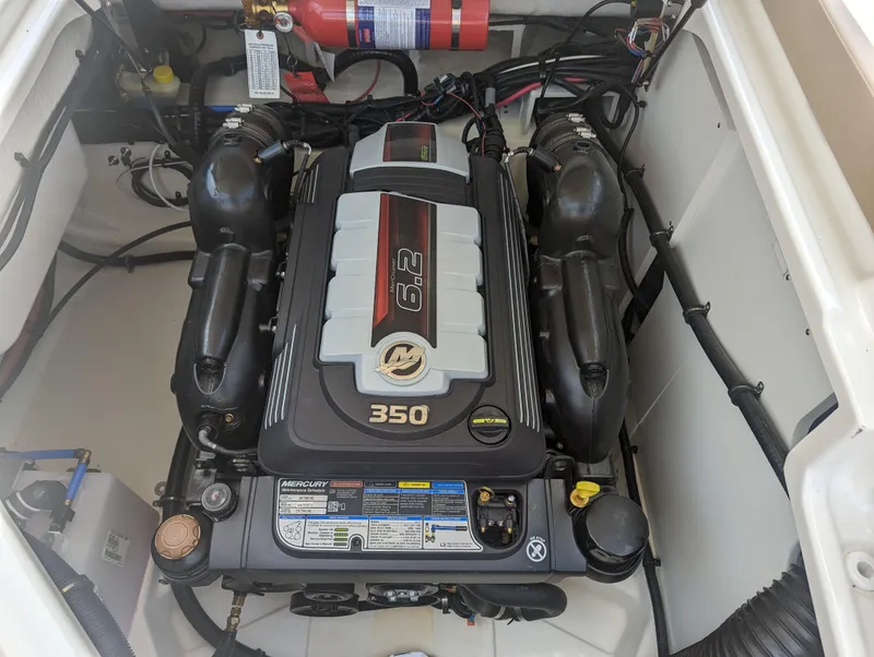 Slide: The Image of 2024 Sea Ray SDX 270 engine compartment with 6.2L 350 HP Mercury engine. - 29
