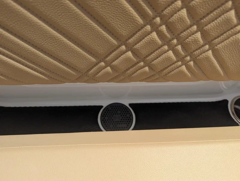 Slide: The Image of Interior detail of 2024 Sea Ray SDX 270 boat with beige upholstery. - 33