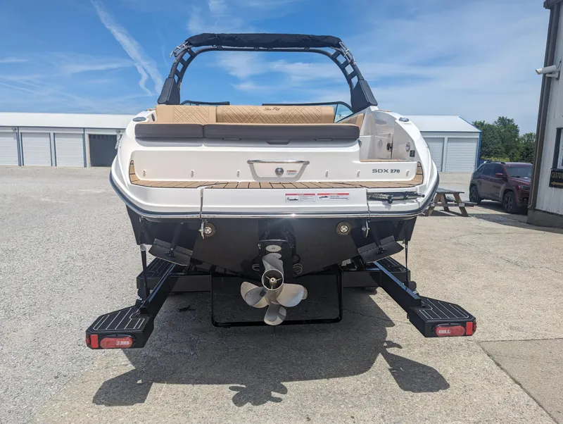 Slide: The Image of 2024 Sea Ray SDX 270 boat rear view with propeller and swim platform. - 5
