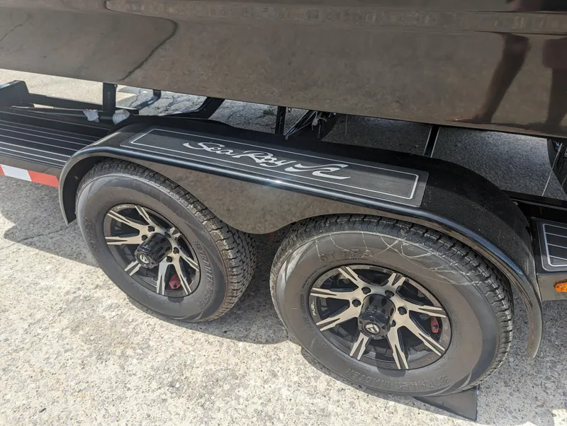 Slide: The Image of 2024 Sea Ray SDX 270 boat trailer with dual wheels. - 9