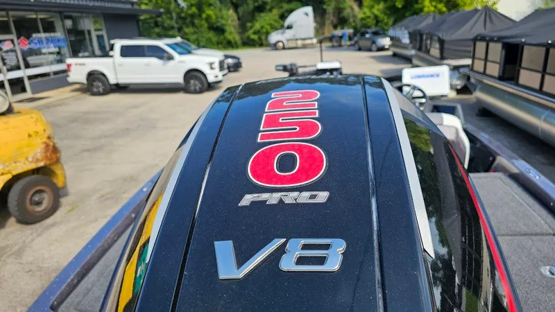 Slide: The Image of 2024 iKon LX21 boat engine with "250 Pro V8" branding in a dealership lot. - 3