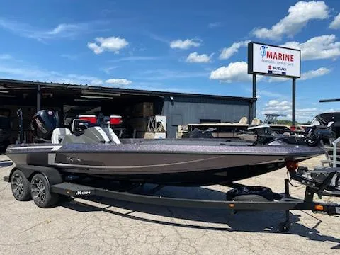 Slide: The Image of 2024 iKon LX20 boat on trailer at marine dealership under blue sky. - 5
