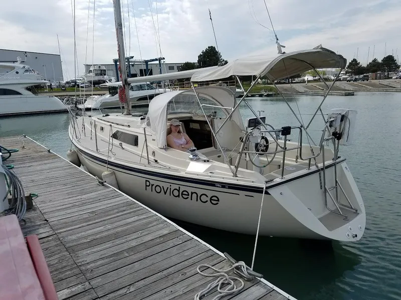 Slide: The Image of 1985 O'Day 35 sailboat named Providence docked at a marina. - 0
