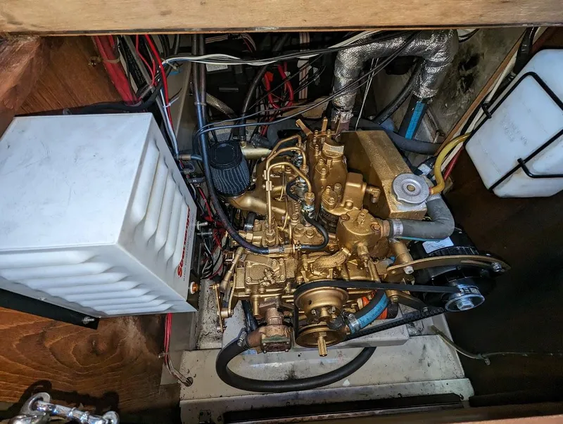 Slide: The Image of 1985 O'Day 35 engine compartment with visible wiring and components. - 19