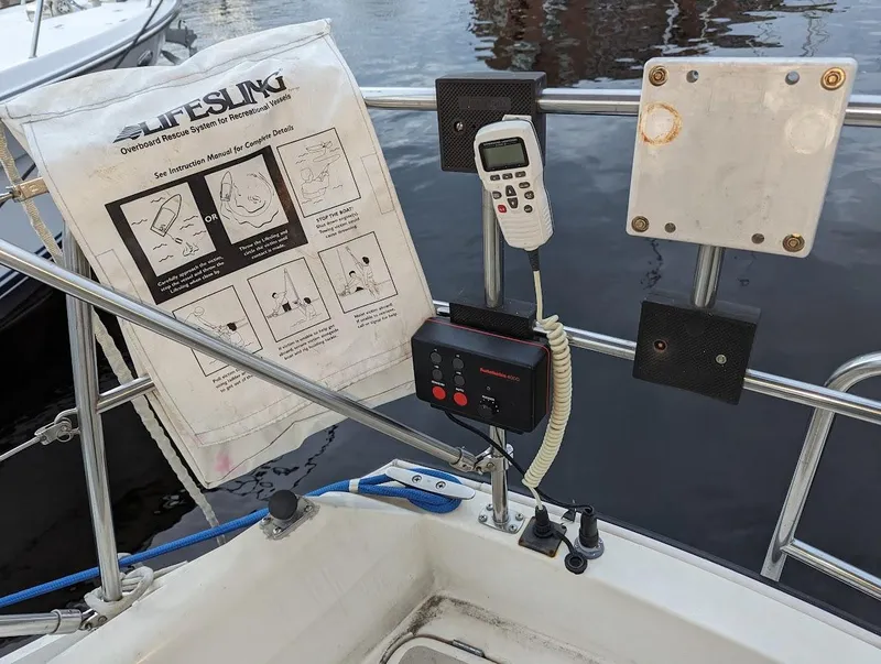 Slide: The Image of Cockpit of 1985 O'Day 35 sailboat with lifesaving equipment and communication devices. - 4
