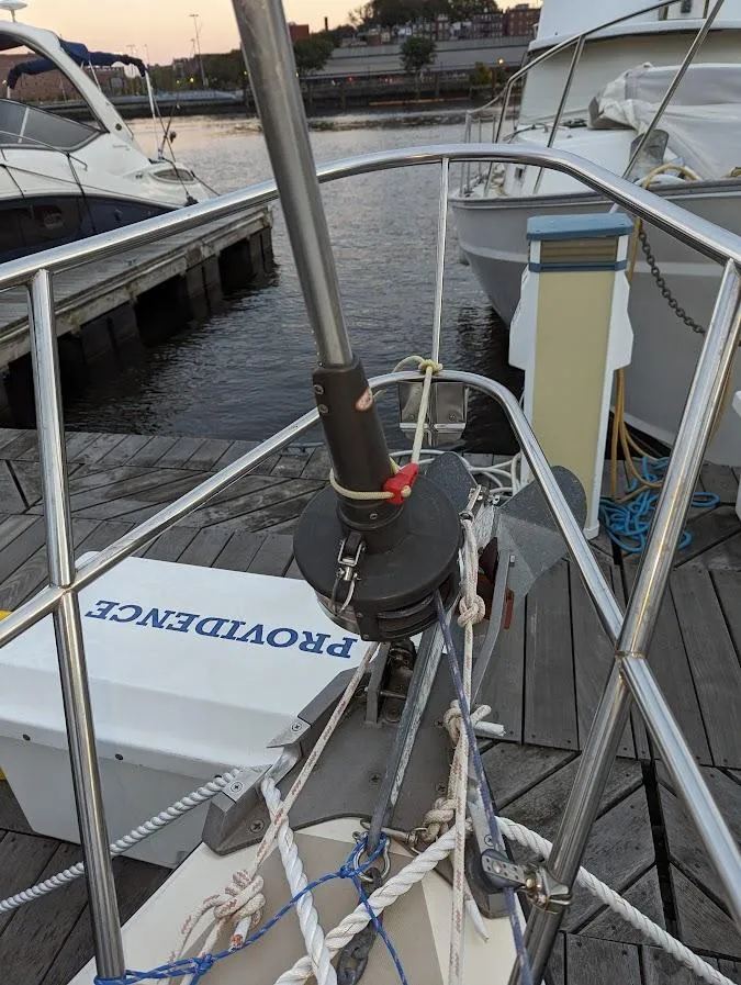 Slide: The Image of Bow of 1985 O'Day 35 sailboat docked, featuring rigging and winch. - 7