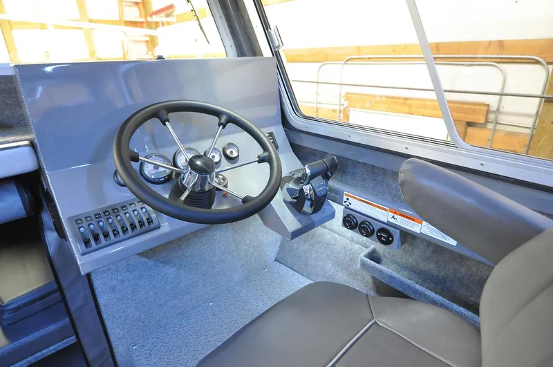 Slide: The Image of Interior of 2024 Spartan 2600 Olympia boat with modern kitchen and seating area. - 12