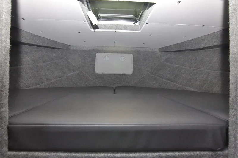 Slide: The Image of 2024 Spartan 2600 Olympia boat interior with seating and table setup. - 19